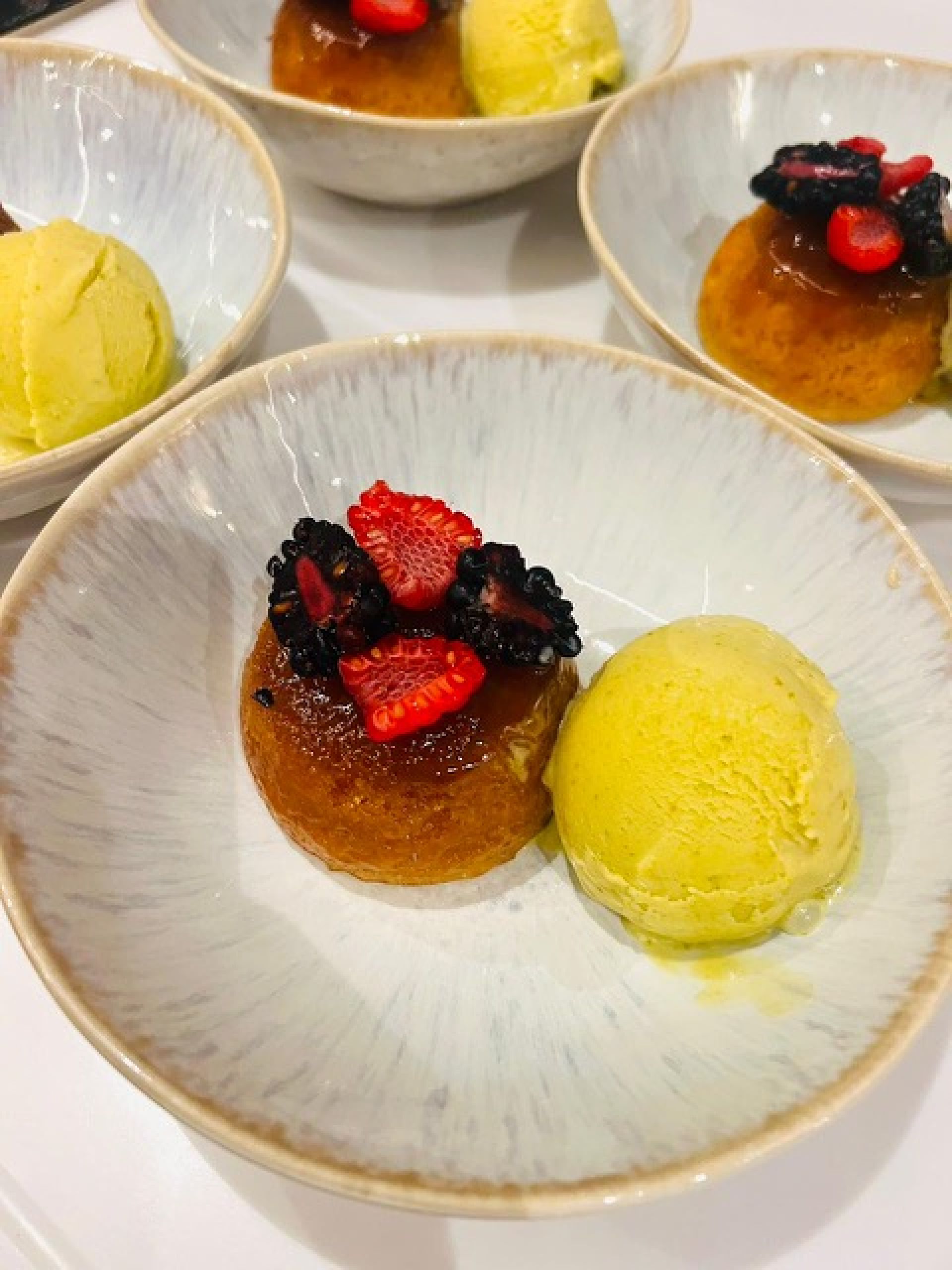 Golden pudding cake with pistachio ice cream