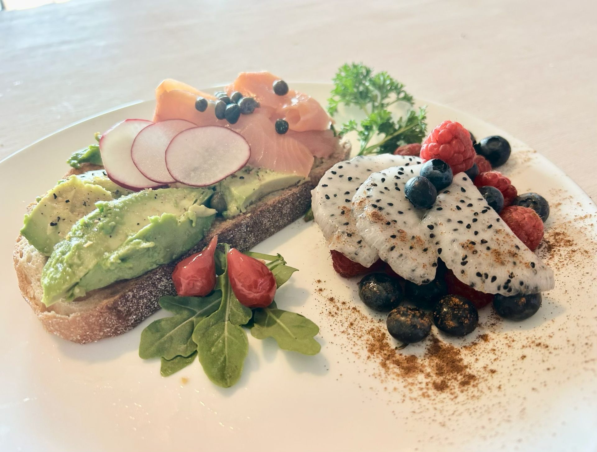 Avo toast with smoked salmon and fruit salad