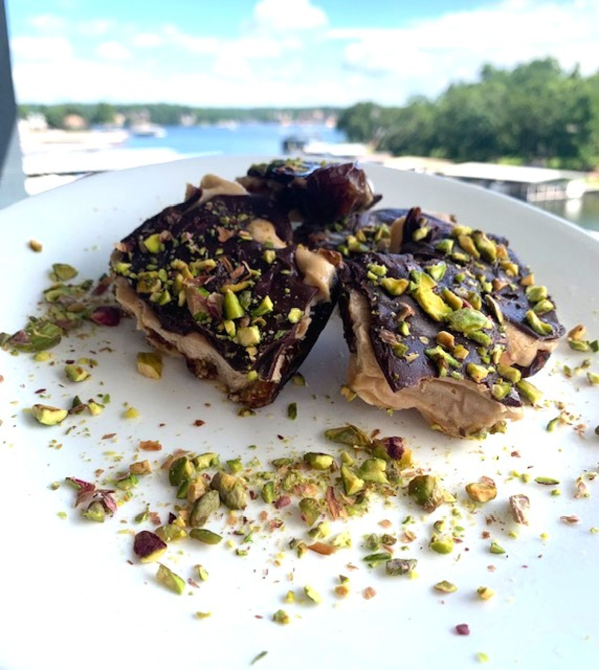 Peanut butter greek yogurt protein bars with melted chocolate and pistachios,